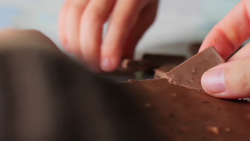 Hands Breaking Chocolate Bar Close-up