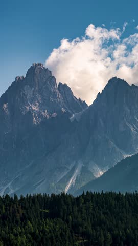 Vertical Time Lapse of Clouds Drifting above Dolomites Rocky Mountains 