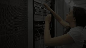Reaching into rack, female technician plugging testing cables while expanding fading code symbols. Technology, data center, network infrastructure, cybersecurity, data flow, digital, connectivity - Powered by Shutterstock - Get 15% off with code: PIKWIZARD15