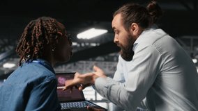Stressed technicians in server room fighting each other after detecting hacking attempt targeting critical systems. Engineering team members under pressure by virus activity arguing, camera B - Powered by Shutterstock - Get 15% off with code: PIKWIZARD15