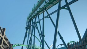 Visitors experience the excitement of exhilarating roller coasters at amusement park, surrounded by vibrant attractions and a clear blue sky. Perfect day for adventure and fun. - Powered by Shutterstock - Get 15% off with code: PIKWIZARD15