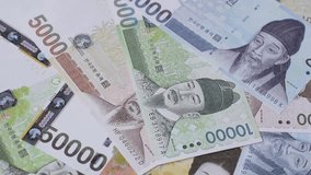 Paper money, South Korean banknotes as a financial business background. Cash, investment, banking - Powered by Shutterstock - Get 15% off with code: PIKWIZARD15