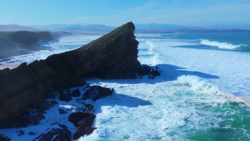 Waves on the cliffs of Madero Beach in the Dunes of Liencres Natural Park. Liencres, Piélagos Municipality, Costa Quebrada Geopark, Cantabrian Sea, Cantabria, Spain, Europe