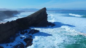 Waves on the cliffs of Madero Beach in the Dunes of Liencres Natural Park. Liencres, Piélagos Municipality, Costa Quebrada Geopark, Cantabrian Sea, Cantabria, Spain, Europe - Powered by Shutterstock - Get 15% off with code: PIKWIZARD15