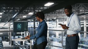 Engineers working together on data center industrial platform, completing software updates. Server hub colleagues doing brainstorming, finetuning server rig configurations, camera B - Powered by Shutterstock - Get 15% off with code: PIKWIZARD15