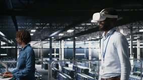 Data center admin using VR headset to monitor neural network AI systems. Server room employee using virtual reality tech to oversee equipment powering machine learning processes, camera A - Powered by Shutterstock - Get 15% off with code: PIKWIZARD15