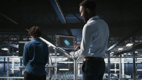 Server hub coworkers visualizing large language model architecture using notebook. Data center technicians on industrial platform collaborating on neural network software tasks using laptop - Powered by Shutterstock - Get 15% off with code: PIKWIZARD15