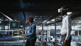 Engineer using VR headset in data center to update server tech, configuring equipment using software tools. Server hub employee reviewing hardware analytics using virtual reality, camera A - Powered by Shutterstock - Get 15% off with code: PIKWIZARD15