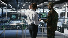 Military experts in data center reviewing drone surveillance feed on laptop screen. Army units in high tech server room doing battlefield reconnaissance operations using notebook, camera A - Powered by Shutterstock - Get 15% off with code: PIKWIZARD15