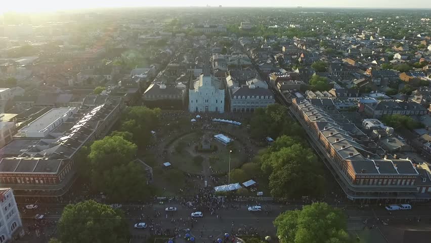 New Orleans Cityscape during French Quarters Music Festival, Louisiana. St. Louis Cathedral City Skyline in Background. Sunset Light. Drone