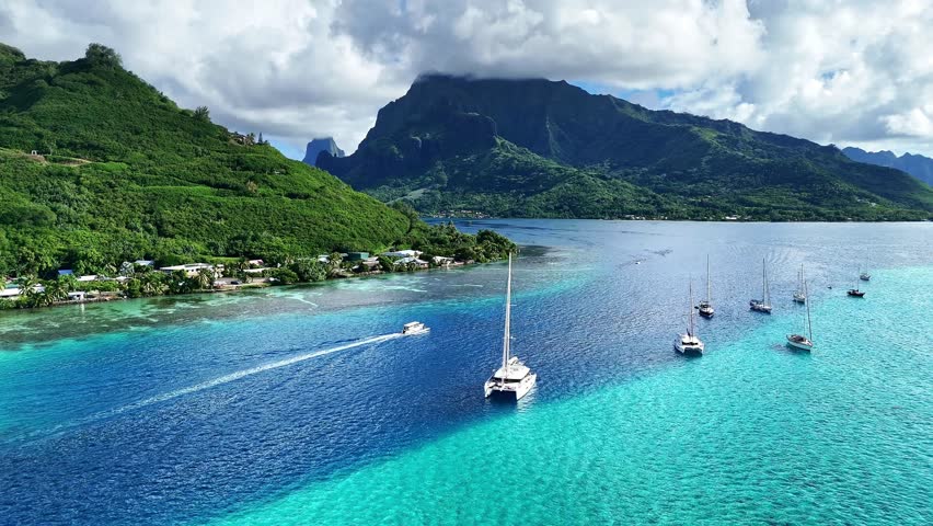 Drone Tahiti. Aerial Moorea island, French Polynesia. Crystal clear water blue lagoon. Exotic travel vacation getaway, romantic honeymoon destination. Famous tourism destination. 