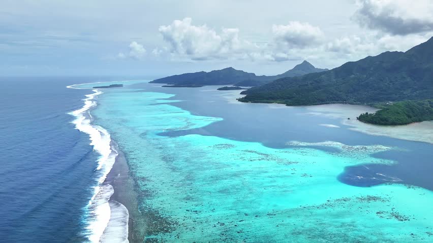 Drone Tahiti. Aerial view of Raiatea island lagoon, coastal landscape. Crystal clear blue water. Exotic travel vacation, romantic honeymoon, tourism destination in French Polynesia. 