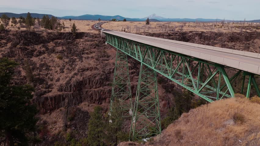 Aerial close approach of highway 26 and the bridge over Mill Creek in Warm Springs Oregon