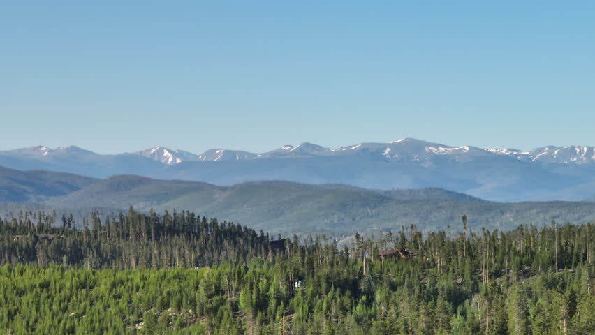 Telephoto drone shot of sunrise in the Rocky Mountains of Colorado