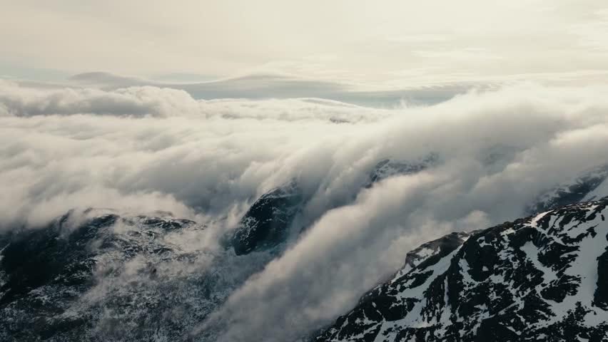 Aerial View Of White Clouds Over Damatic Mountains In Lofoten, Norway.