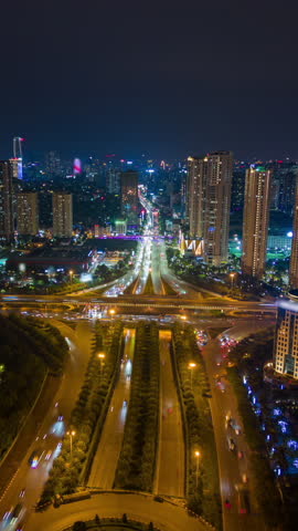 Aerial night timelapse of Hanoi, Vietnam, showing illuminated skyscrapers, vibrant traffic, and glowing city lights. Ideal for urban, travel, and infrastructure themes.