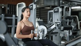 Fitness woman exercising back muscles on a cable row machine - Powered by Shutterstock - Get 15% off with code: PIKWIZARD15