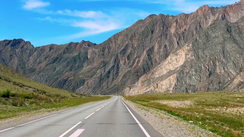 Road of Chuysky Trakt running along Katun River Altai Russia. Scenic route following Siberian mountain river through natural landscape. High quality 4k footage