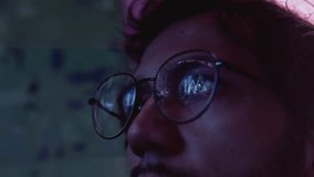 Portrait of man with glasses looks at an AI monitor, the result of artificial intelligence research. Face of male sees a 3D model of a neural network, a vr image. Virtual reality reflection - Powered by Shutterstock - Get 15% off with code: PIKWIZARD15