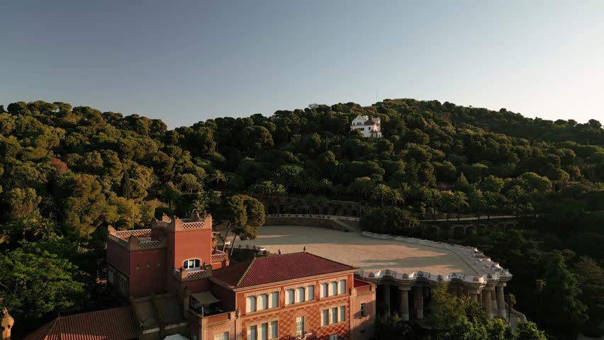 aerial view of parc guell, a landmark tourist attraction in Barcelona, Spain at sunrise, empty