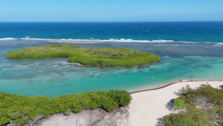 El Jobo Island From Playa Caobita In Summer In Azua, Dominican Republic. - aerial shot