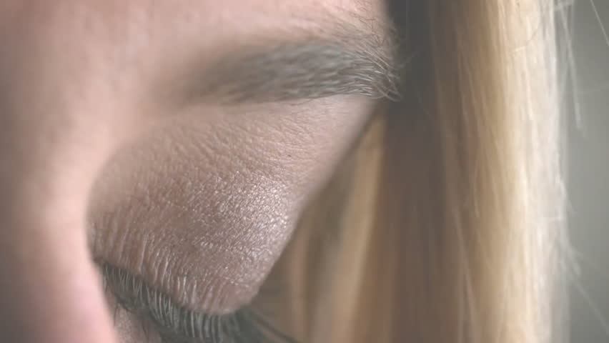 Beginning with closed eye fading HUD rings rotating opening lid, code scrolling completing scan. Futuristic, biometric, technology, data, digital, interface, innovation