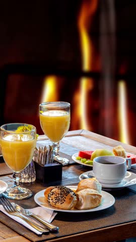 Breakfast with a fireplace in the background