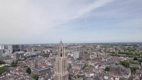 Descending aerial reveal cathedral nave of De Dom church tower and the gothic architecture of the Utrecht diocese ambulatory and transept. Holland religious tourist destination seen from above. - Powered by Shutterstock - Get 15% off with code: PIKWIZARD15