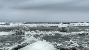 Coastal scene of an icy, rugged shoreline with sea waves crashing in the background. Captures the stark contrast between frozen ice formations and the dynamic ocean waves.
 - Powered by Shutterstock - Get 15% off with code: PIKWIZARD15
