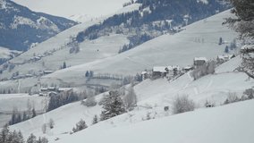 Rolling hills dusted with fresh snow frame a distant view of rustic alpine villages in a wintry mountain setting. - Powered by Shutterstock - Get 15% off with code: PIKWIZARD15