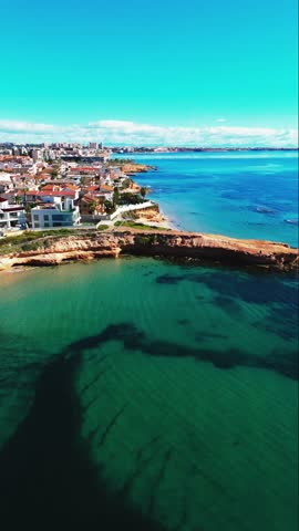 Aerial shot, drone point of view of Torre de la Horadada, Spanish town located on Mediterranean Sea. Costa Blanca. Spain