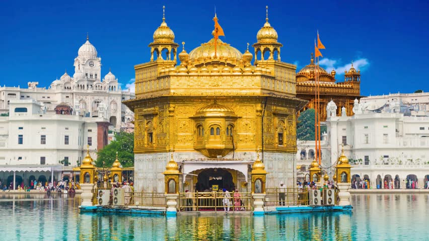 Sikh gurdwara Golden Temple (Harmandir Sahib). Holy place of Sikihism. Amritsar, Punjab, IndiaThe Golden Temple (Harmandir Sahib) and Amrit Sarovar (Pool of Nectar) (Lake of Nectar), illuminated at du
