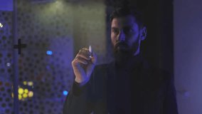 In dark room businessman use pencil write on transparent screen. Communication network. Digital transformation, analytics, connection, notes, programming, virtual reality. Slow motion - Powered by Shutterstock - Get 15% off with code: PIKWIZARD15