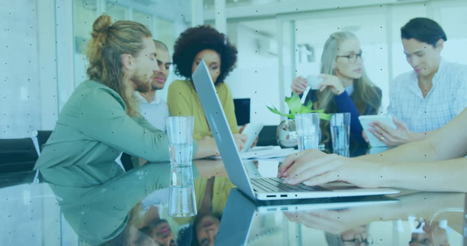 Business professionals tapping laptop visualising network data while overlay rising over table. Collaboration, teamwork, dataanalysis, digitalnetwork, enterprise, businessintelligence, modernoffice