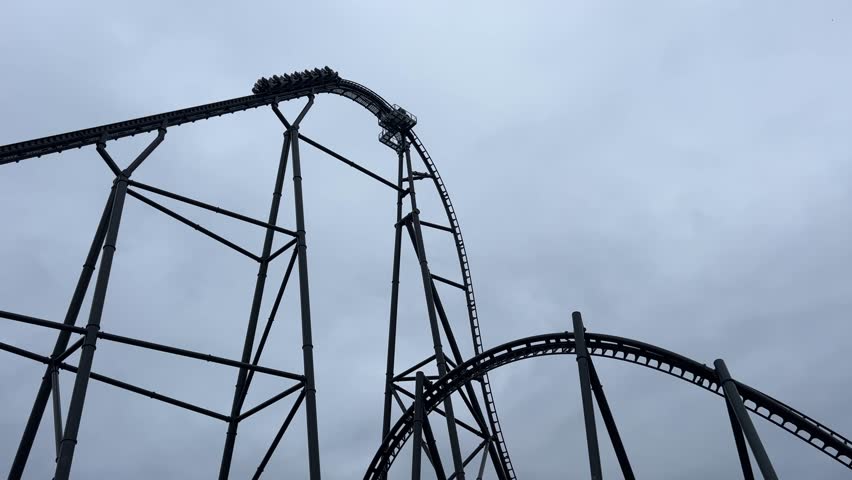 Energylandia, high-speed roller coaster climbs steep track at an amusement park