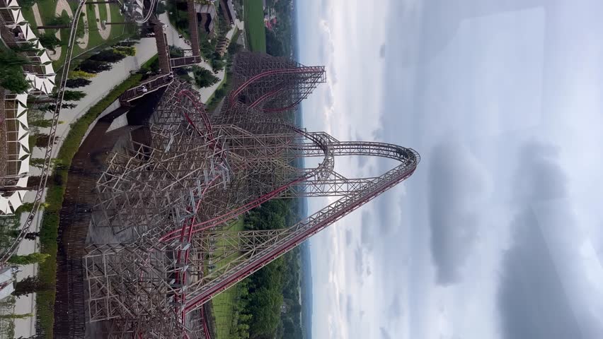 Energylandia, high-speed roller coaster climbs steep track at an amusement park