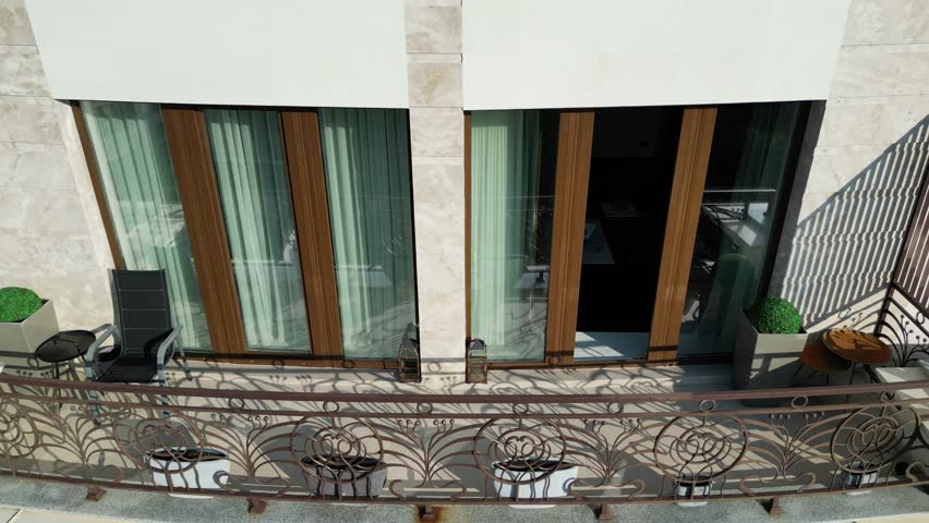 Aerial drone footage of a premium high-rise residential building in central Chișinău, Moldova. Captures modern architecture, clean city infrastructure, and upscale urban living. Ideal for real estate,