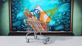 Shopping Cart Filled with School Supplies by Blackboard. shopping for back to school stopmotion  - Powered by Shutterstock - Get 15% off with code: PIKWIZARD15