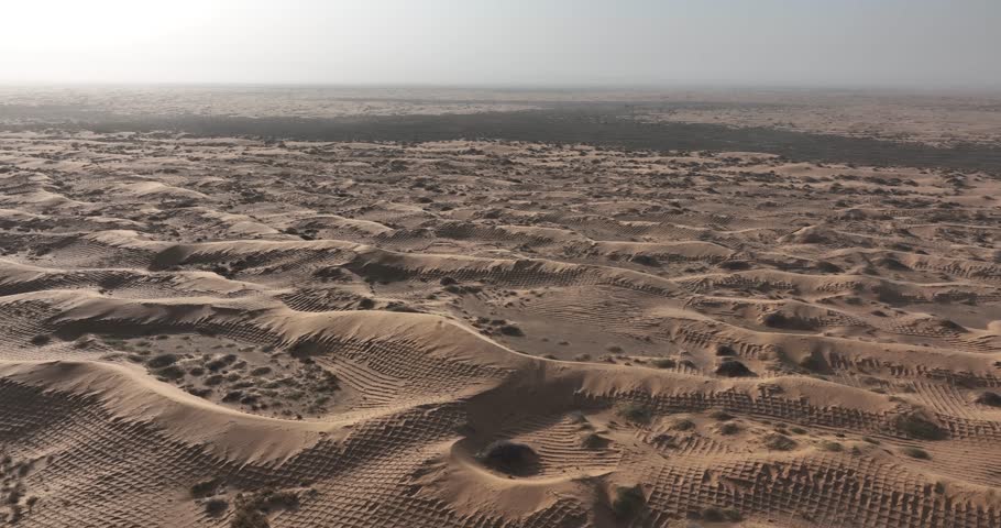 Aerial footage of the mobility and translocation of sand dunes and sand encroachment in desert