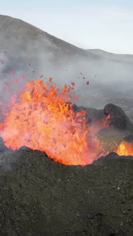 Vertical Screen: Volcano eruption in 2023, Red burning lava erupts from the ground in Iceland. Formation of a new active volcano. Aerial footage. Shot for Social Media.
