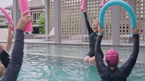 Group Asian Geriatric exercise before Aquatic therapy in swimming pools or hydrotherapy pools by coach Physiotherapist.Elderly hydrotherapy,physiological wellness,Balance training,health care concept - Powered by Shutterstock - Get 15% off with code: PIKWIZARD15