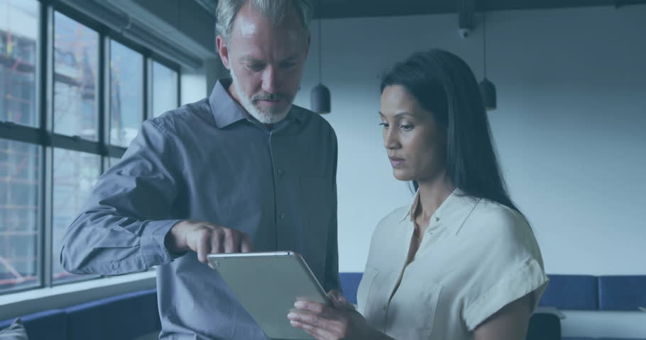 Business duo pointing tablet and generating holographic charts then expanding world map for review. Technology, collaboration, analytics, innovation, urban, professional, data visualization