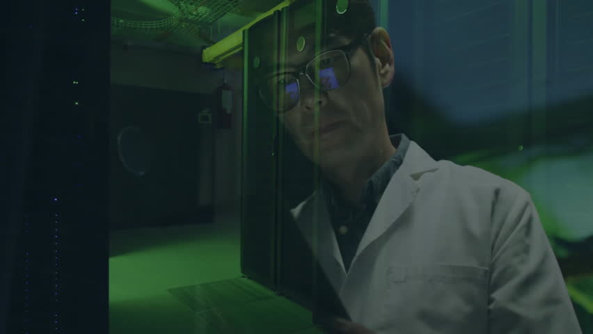 Approaching data center panel, technician scanning green data doing diagnostics by tapping tablet. Technology, cybersecurity, innovation, analytics, digital, futuristic, engineering - Powered by Shutterstock - Get 15% off with code: PIKWIZARD15