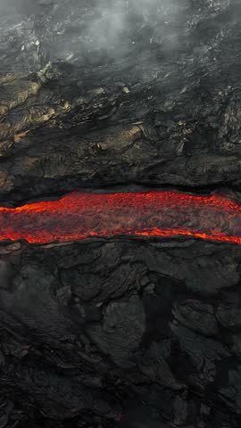 Vertical Screen: Volcano eruption in 2023, Red burning lava erupts from the ground in Iceland. Formation of a new active volcano. Aerial footage. Shot for Social Media.