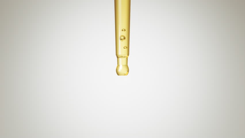 Liquid serum or cosmetic oil is dripped onto the skin to treat and restore the skin.