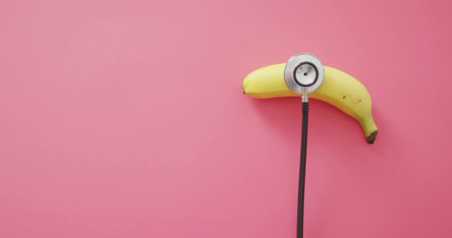 Stethoscope pressing banana starting UI bubbles floating then fading while visualizing health data. Diagnostic, healthtech, minimalistic, digital, medical, futuristic, wellness