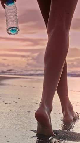 Environment Pollution by Woman Throwing Plastic Bottle at Beach Close-up. Rising Issue of Refuse and Waste in Clean Tropical Water. Messy Female Going and Dropping Trash Outdoors Harming Nature Zone