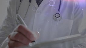 Male doctor using stylus and analyzing patient data on tablet, animating health holographic network. Medical, technology, futuristic, innovation, digital, health, analysis - Powered by Shutterstock - Get 15% off with code: PIKWIZARD15