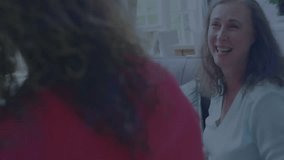 Facilitator handing VR headset to senior man, group watching, floating data streams simulating VR. Technology, innovation, teamwork, immersion, digital, connection, interaction - Powered by Shutterstock - Get 15% off with code: PIKWIZARD15