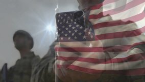 Soldier raising smartphone at sunlit parade using technology American flag overlay tapping screen. Military, patriotism, communication, technology, unity, discipline, leadership - Powered by Shutterstock - Get 15% off with code: PIKWIZARD15